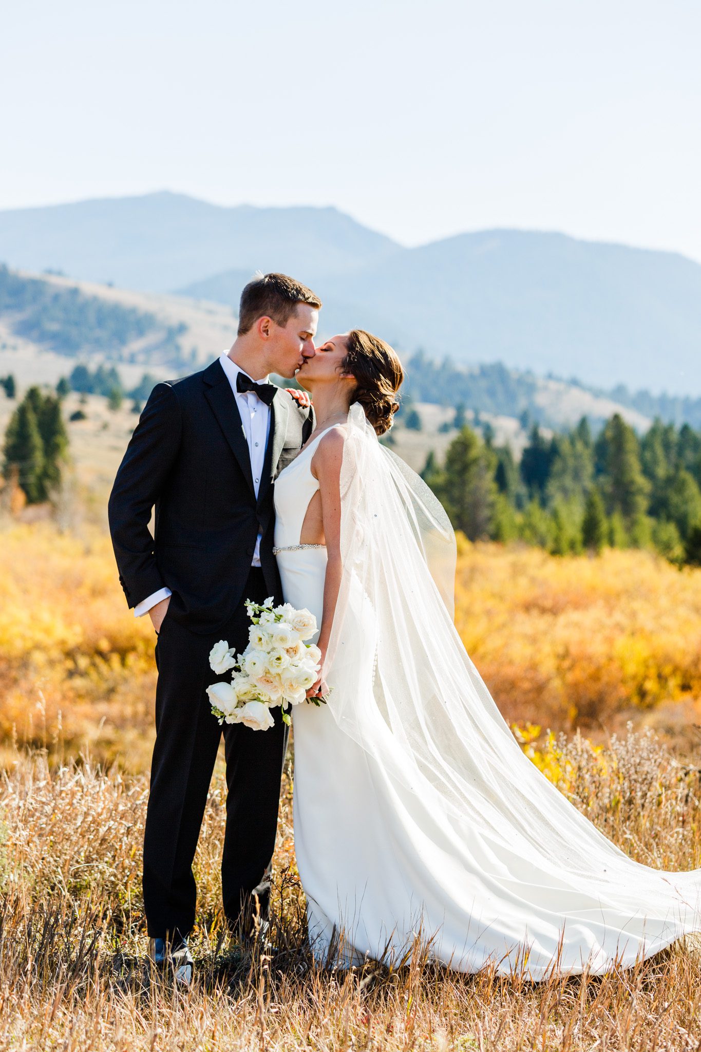 wedding couple in big Sky montana in front of the moutains