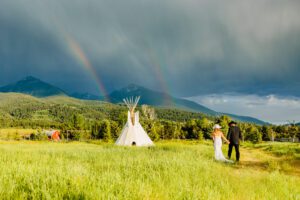 married couple with rainbow, tips to elope in Paradise Valley