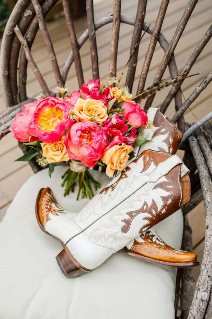 brides cowboy boots and bouquet
