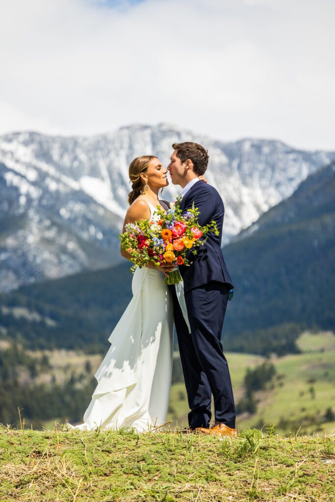bride and groom kissing during their montana wedding
